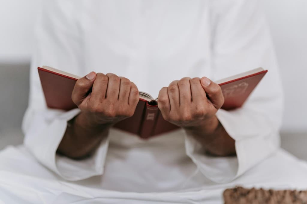 Person holding an open mushaf